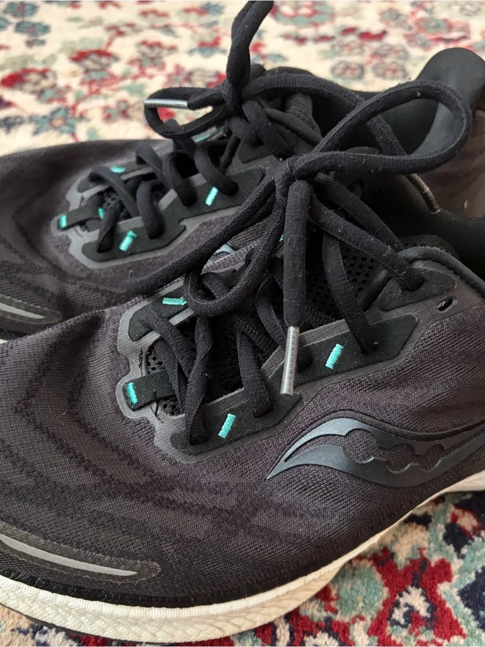 Saucony Black Running Shoes with Teal Accents